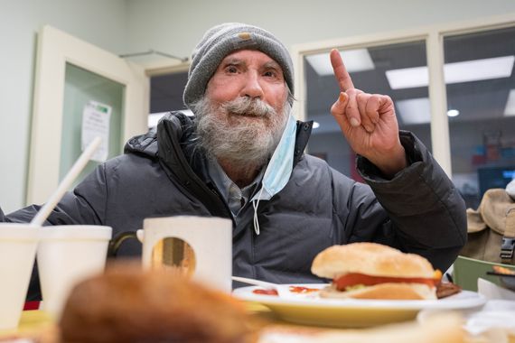 man eating at table in Corner Drop-in