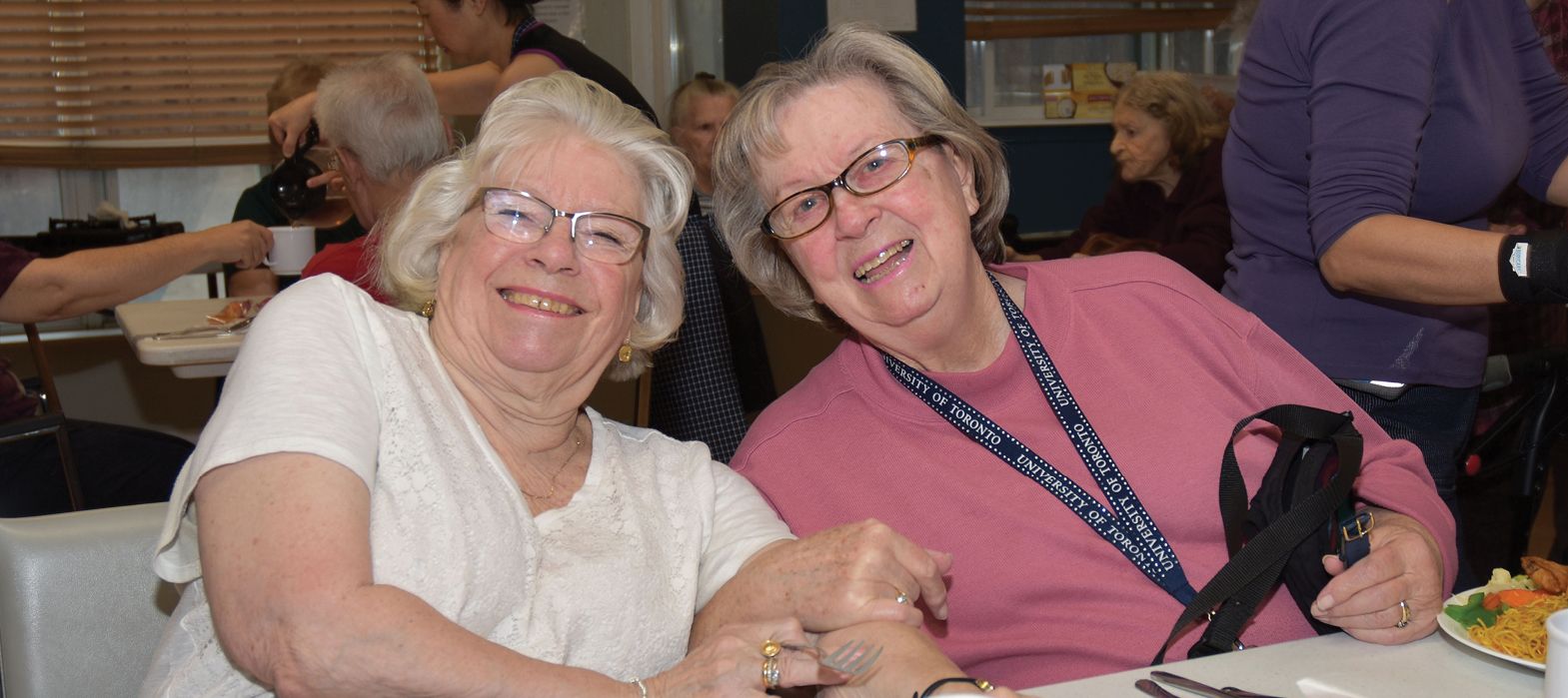 seniors smiling at a table