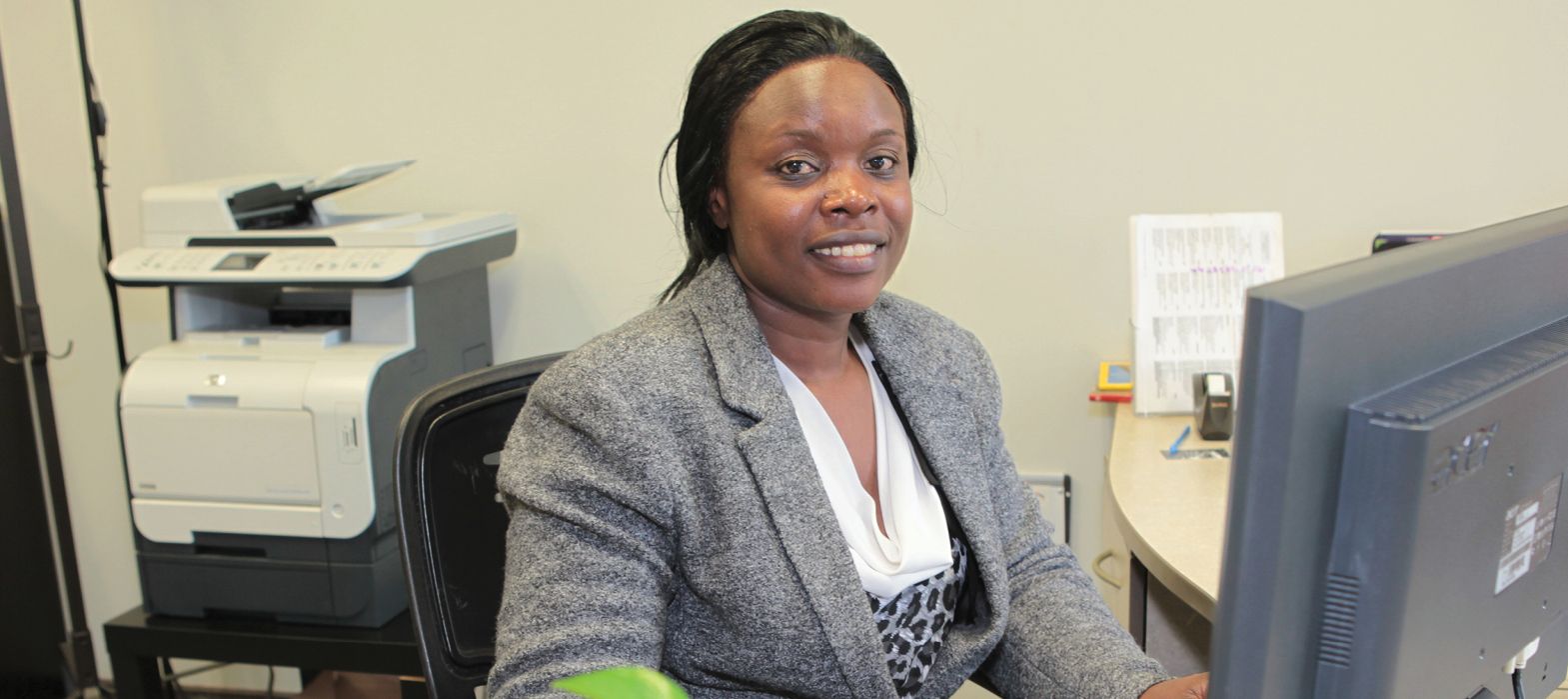 smiling woman at office desk
