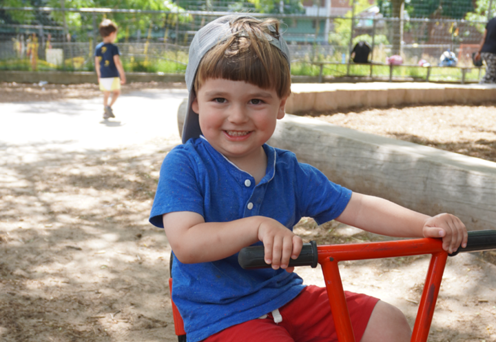 boy on tricycle