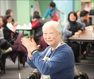 eldery woman applauding