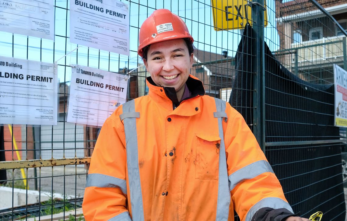 young woman working on construction site