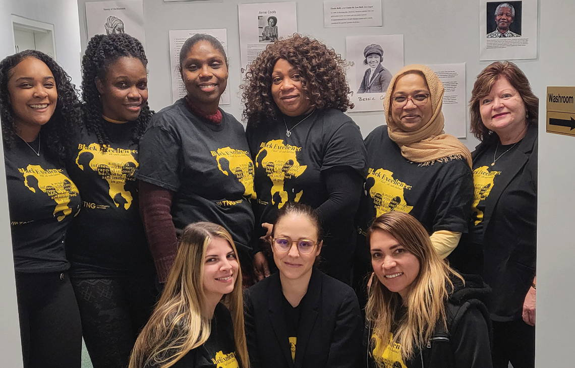 TNG staff members wearing "Black Excellence" t-shirts