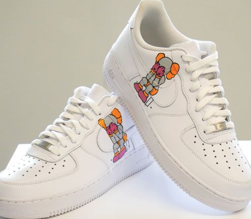 pair of shoes with kid's design