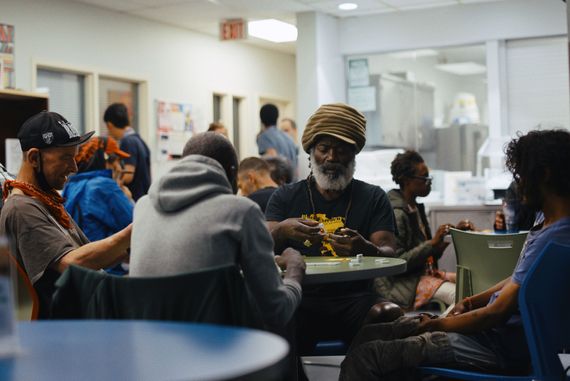 group of people sitting in the Corner Drop-in