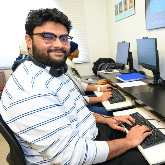 man sitting at a computer