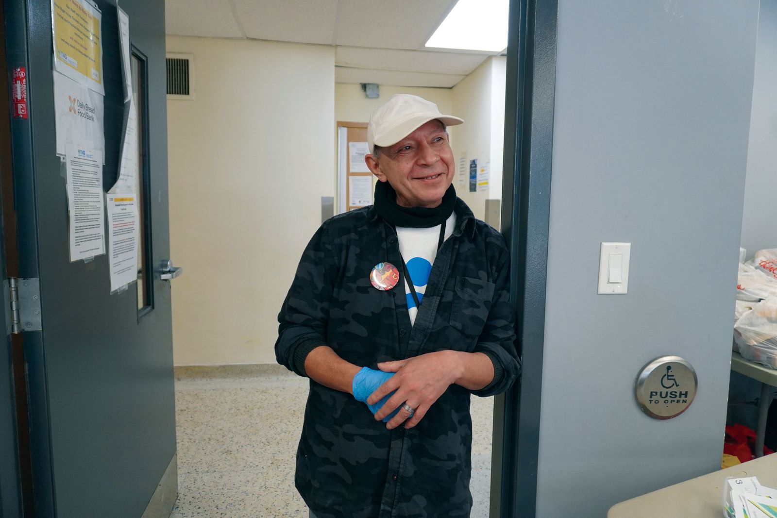 smiling man standing in doorway